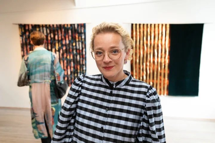Thumbnail of - Randi Samonsen with her artwork, displayed at the National Gallery in the Faroe Islands.