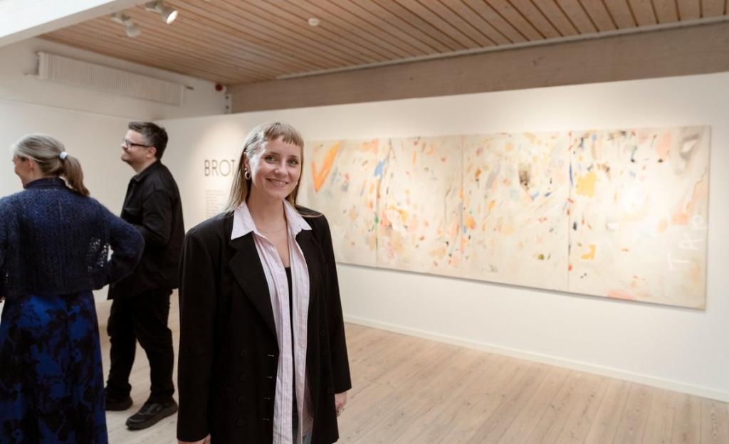 Kirstin Helgadóttir with her artwork, displayed at the National Gallery in the Faroe Islands.
