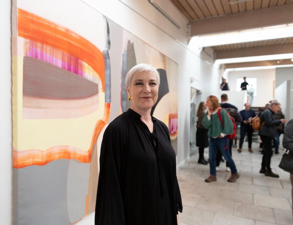Hansina Iversen with her artwork at the National Gallery in the Faroe Islands.