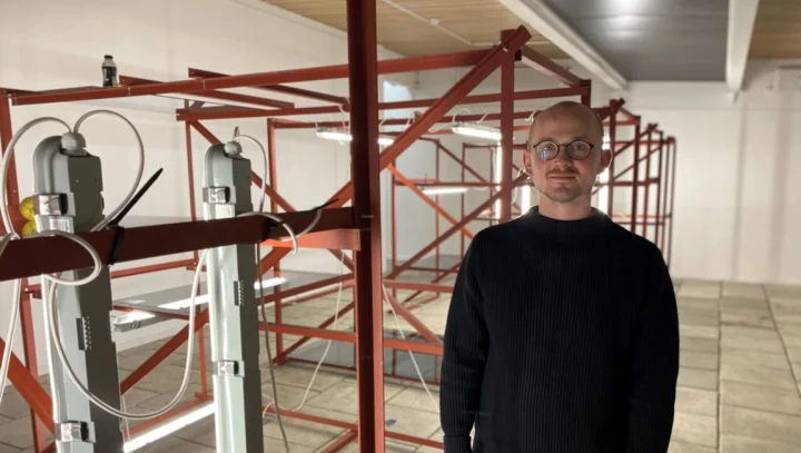 Thumbnail of - Jóhan Martin Christiansen with his artwork at the National Gallery in the Faroe Islands.