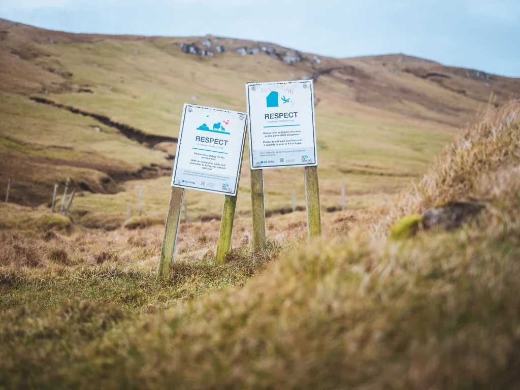 Respect signs are seen in the mountains on a hike to Sandoy in the Faroe Islands. Take by Daniel Villadsen.