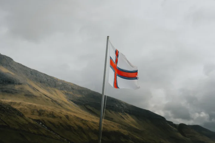 Thumbnail of - How old is the Faroese flag? What does the flag of the Faroe Islands look like?  What does Merkið mean?